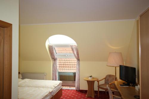 Postel nebo postele na pokoji v ubytování Hotel Bürgerhof