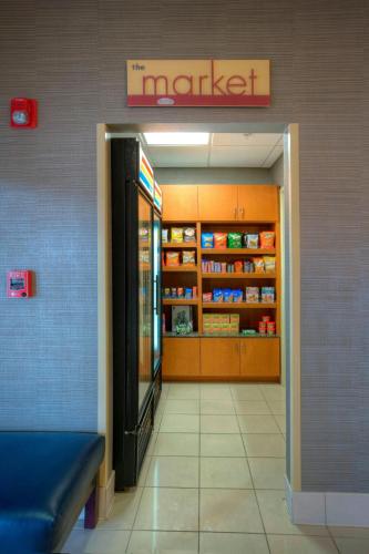 a grocery store entrance with a market sign on the wall at SpringHill Suites by Marriott - Tampa Brandon in Tampa