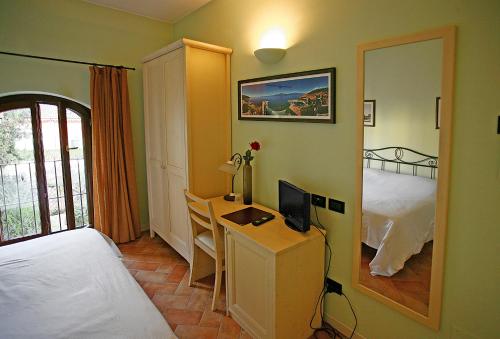 Postel nebo postele na pokoji v ubytování Hotel Antichi Cortili