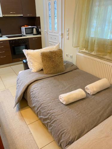 a bed with two pillows on it in a kitchen at Resort Dimitris in Alexandroupoli