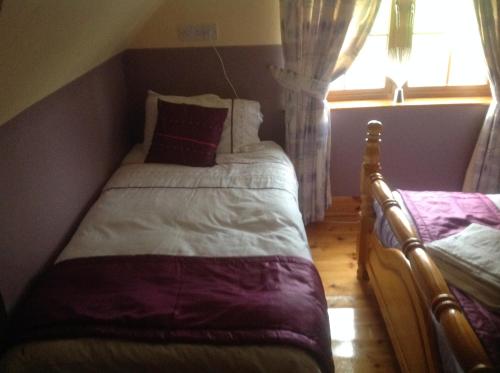 a bedroom with two beds and a window at Country House B@b in New Twopothouse Village