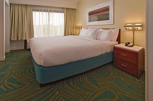 a hotel room with a large bed and a window at SpringHill Suites by Marriott Gaithersburg in Gaithersburg