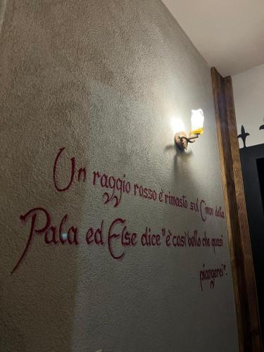 a writing on the wall of a room at Castel Madonna in San Martino di Castrozza