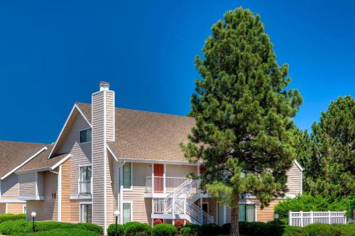 a house with a tree in front of it at Residence Inn Denver Tech Center in Greenwood Village