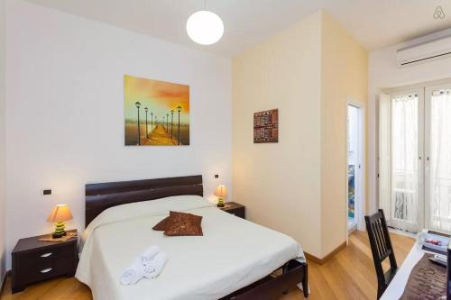 a bedroom with a large white bed in a room at Bed and Breakfast Adelberga in Salerno