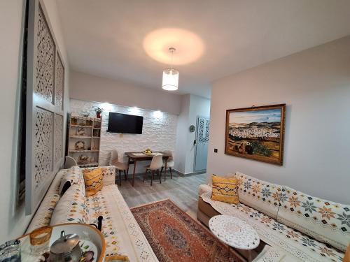 a living room with a couch and a table at Casanoha in Fnidek