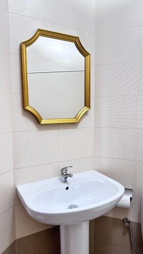 a bathroom with a sink and a mirror on the wall at Centrally Located Gzira in Il-Gżira