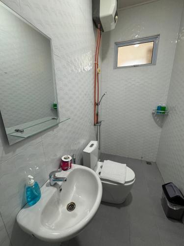 a bathroom with a sink and a toilet at Monde Residence Block K number 17 in Bagam