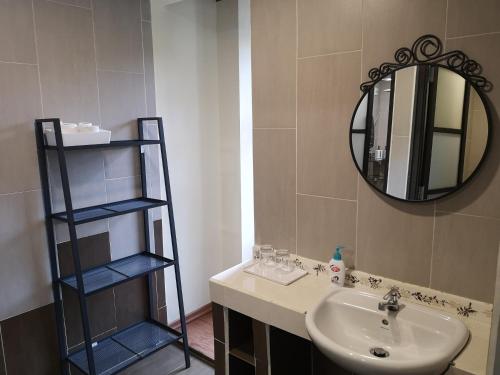 a bathroom with a sink and a mirror at Forest Lodge, Radiant Janda Baik in Bentong