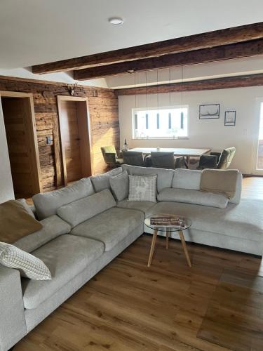 a living room with a couch and a table at Mountain Resort in Rangersdorf