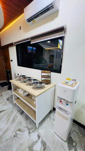 a room with a large mirror on a wall at Camelia Guesthouse Syariah in Pacitan