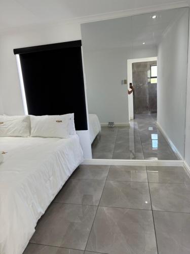 Un ou plusieurs lits dans un hébergement de l'établissement Exclusive Townhouse at The Square