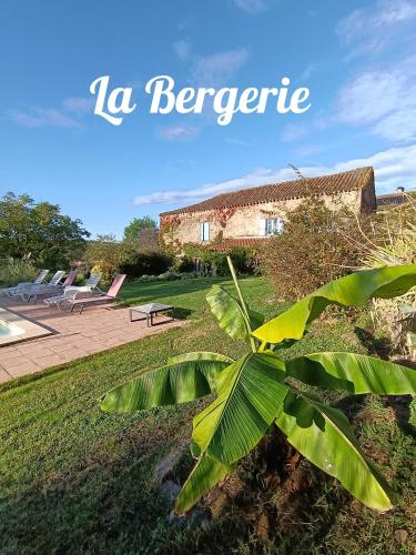 a plant in front of a building with the words la barrere at Gite Les Volets Bleus du Segur in Le Ségur-Suech