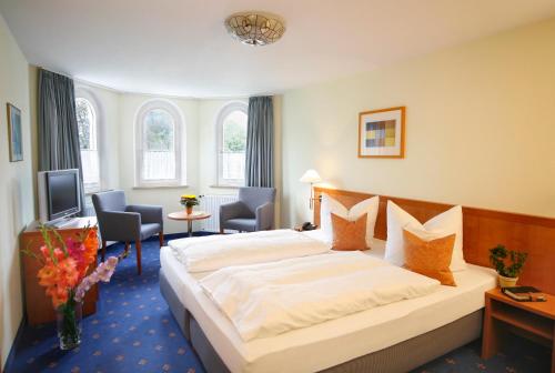 Postel nebo postele na pokoji v ubytování Hotel Johannisbad