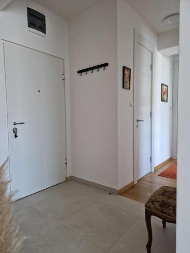 a room with white walls and a door at Stan na dan 34 in Banja Luka