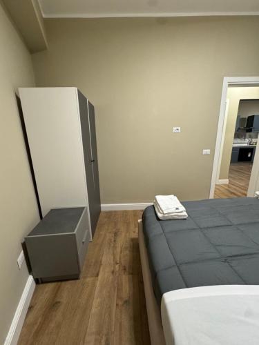 a bedroom with a bed and a dresser in it at Il Rifugio in Piazza in Castel di Sangro