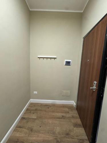 an empty room with a door and a wooden floor at Il Rifugio in Piazza in Castel di Sangro
