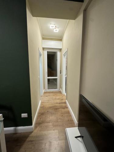 an empty room with a hallway with a door at Il Rifugio in Piazza in Castel di Sangro