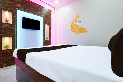 Postel nebo postele na pokoji v ubytování Hotel O Royal King