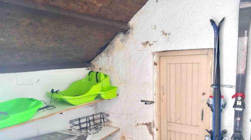 a room with a green item on a shelf next to a door at Superbe T3 esprit chalet avec vue panoramique in Font-Romeu
