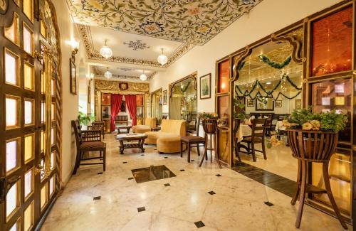 a living room with a couch and chairs at Umaid Residency - A Regal Heritage Home in Jaipur