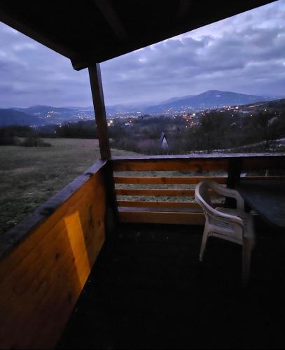 a chair sitting on a balcony with a view at blanca 6 in Nova Bila