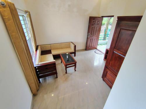 an overhead view of a room with a bench and a table at The Autumn by Maat Hotels in Vagamon