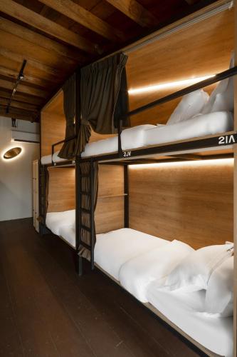 a group of bunk beds in a room at Armenian House by IIP in George Town