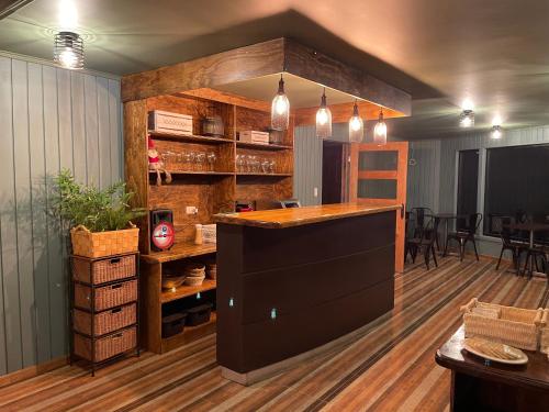 a bar in the middle of a room at Hotel Bután Coronel in Coronel
