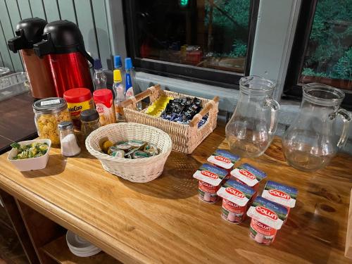a wooden table with a bunch of food on it at Hotel Bután Coronel in Coronel