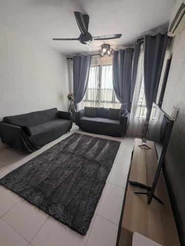 a living room with a couch and a rug at Kyra The Heights Residence Condo Ayer Keroh Melaka WiFi, Netflix & Pool in Ayer Keroh