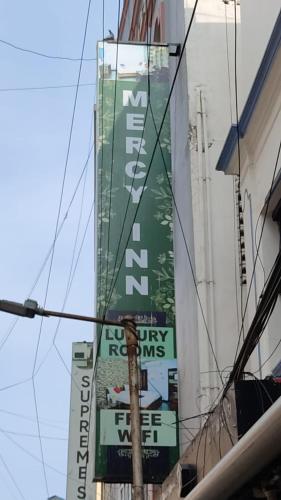 Un certificado, premio, letrero u otro documento en MERCY INN