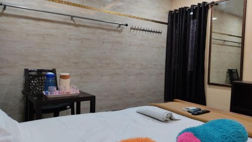 Una cama o camas en una habitación de MERCY INN