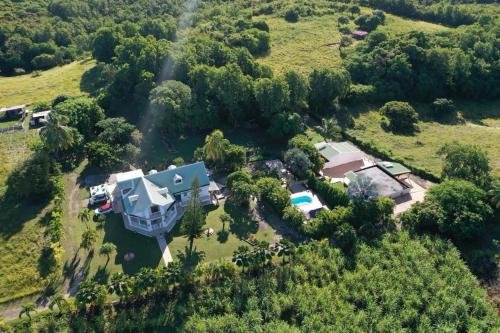 an aerial view of a house on a hill at L'ASETA Paradise in Grand-Bourg