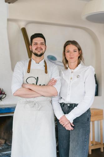 a man and a woman standing in a kitchen at Hotel - Restaurant Soleo in Krumpendorf am Wörthersee