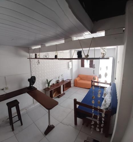 a living room with a swing and a couch at Ganesha Hostel in Pipa