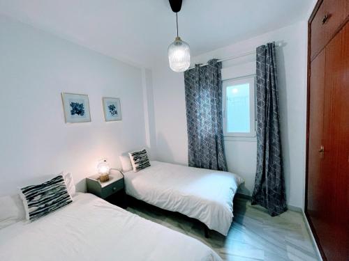 Posteľ alebo postele v izbe v ubytovaní Central Apartment in Sanlucar