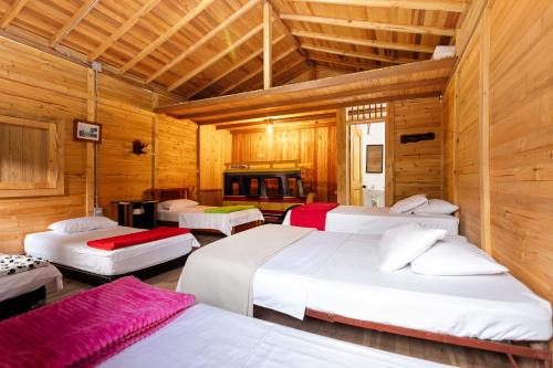 Postel nebo postele na pokoji v ubytování Hotel Orillas del Pizano