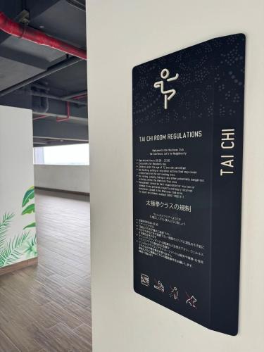 an informational sign on a wall in a room at Apt Embarcadero 2BR with Netflix & Pool by Damaresa in Pondokpucung