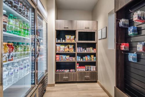 a refrigerator filled with lots of drinks and food at Residence Inn by Marriott Dallas DFW Airport West/Bedford in Bedford