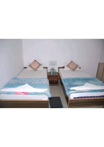 Postel nebo postele na pokoji v ubytování Sharda Guest House