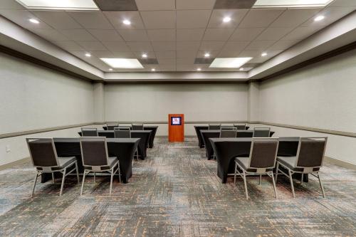 a conference room with tables and chairs in it at Huntsville Marriott at the Space & Rocket Center in Huntsville