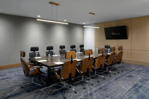 a conference room with a long table and chairs at Marriott Tacoma Downtown in Tacoma