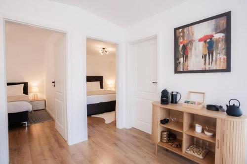 a room with a bedroom with a bed with umbrellas at TheNest in Mărişel