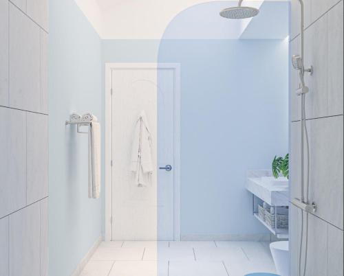 a bathroom with a shower with a glass door at Eriyadu Island Resort in Reethi Rah