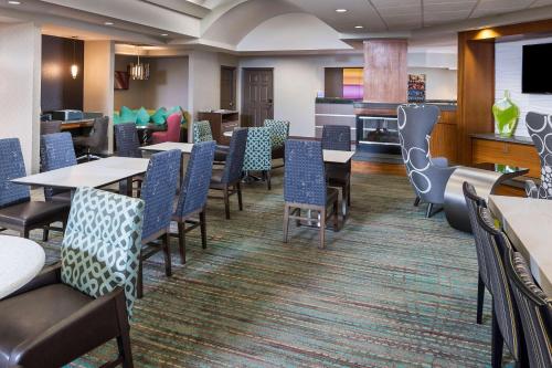 a large dining room with tables and chairs at Residence Inn Huntsville in Huntsville