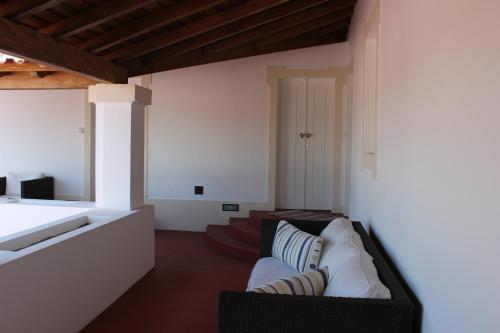 a living room with a couch and a table at Tapada da Rabela - Reserva Natural in Marvão