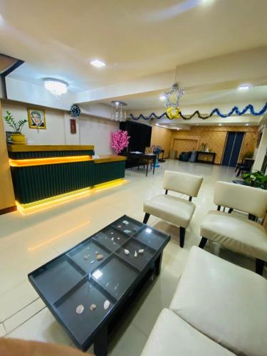 a waiting room with a table and chairs at Residency Hotel Bangkok in Bangkok