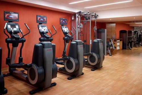 a gym with a row of exercise bikes in a room at Niagara Falls Marriott on the Falls in Niagara Falls