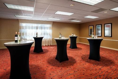 a room with a row of tables with bottles of wine at Residence Inn San Diego Sorrento Mesa/Sorrento Valley in Sorrento